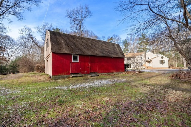 exterior space with a yard and an outdoor structure