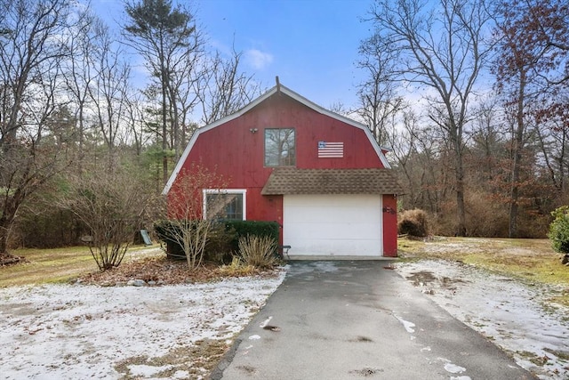 view of side of home with a garage