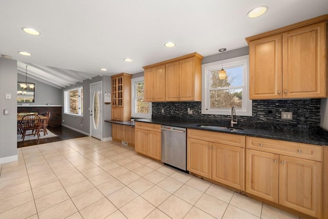 kitchen with a wealth of natural light, dishwasher, pendant lighting, and sink