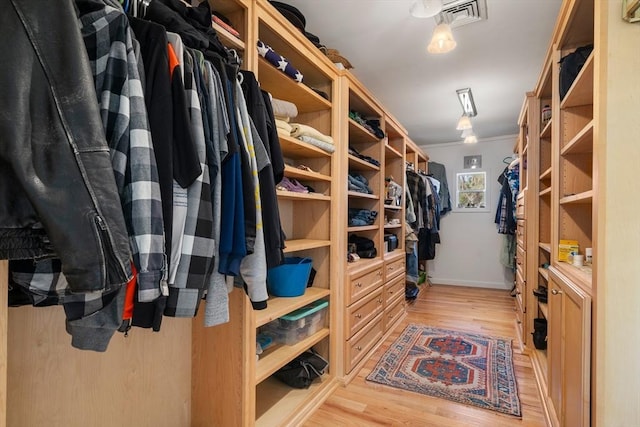 walk in closet featuring light wood-type flooring