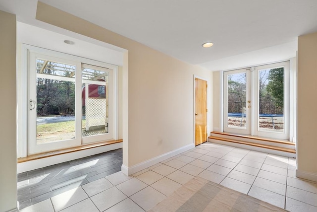 interior space with light tile patterned floors