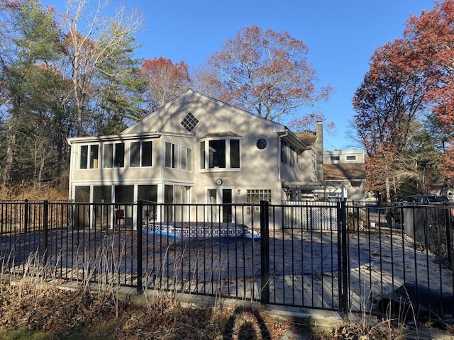 view of front of house with a sunroom