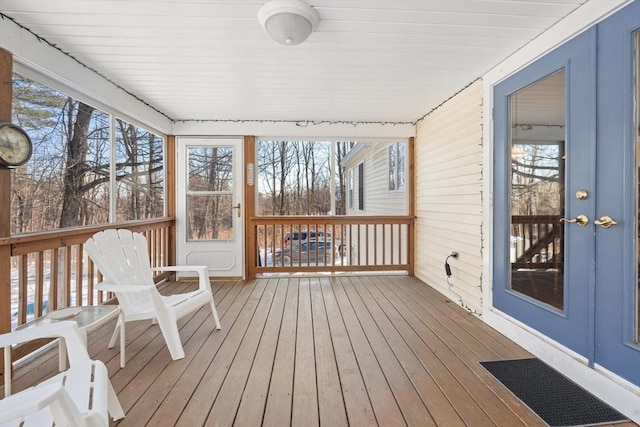 unfurnished sunroom with a wealth of natural light