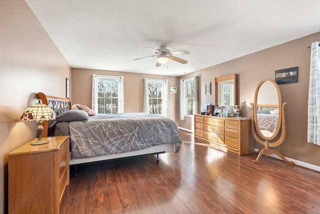 bedroom featuring ceiling fan and dark hardwood / wood-style floors