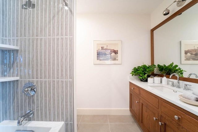 bathroom with baseboards, vanity, shower / tub combination, and tile patterned floors