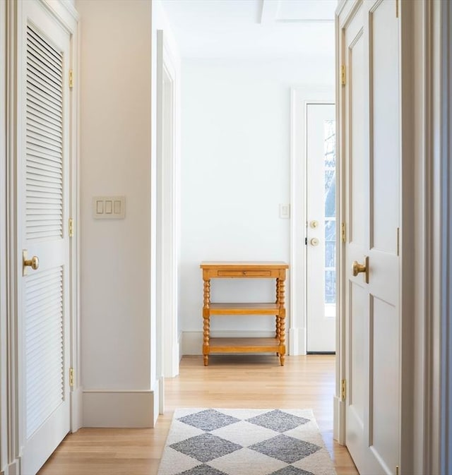 hall with light wood-style floors