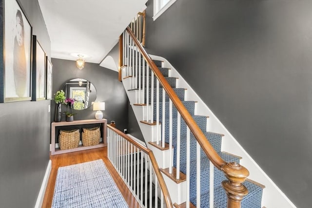 stairway featuring wood finished floors