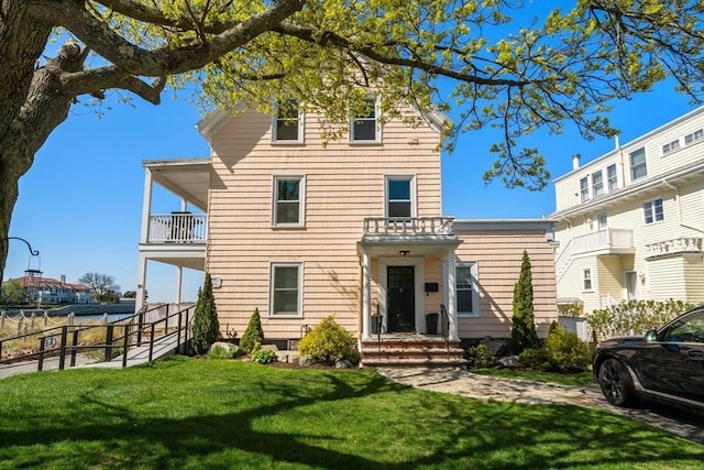 view of front of home with a balcony