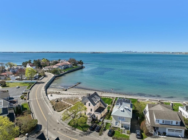 aerial view of residential area with a nearby body of water