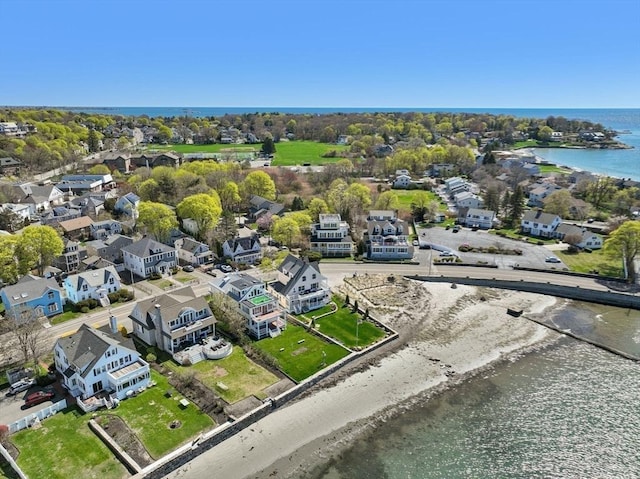 aerial perspective of suburban area featuring a nearby body of water