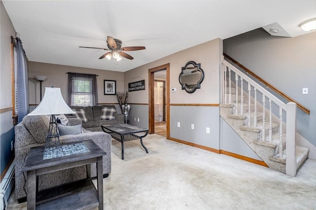 150 Appleton Cir, Fitchburg, MA 01420 - living room featuring a ceiling fan, carpet flooring, stairs, and a baseboard radiator