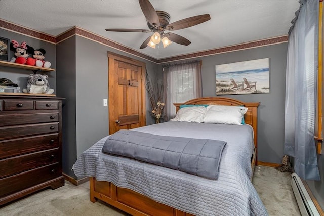 150 Appleton Cir, Fitchburg, MA 01420 - bedroom with light colored carpet, a baseboard heating unit, baseboards, ceiling fan, and crown molding