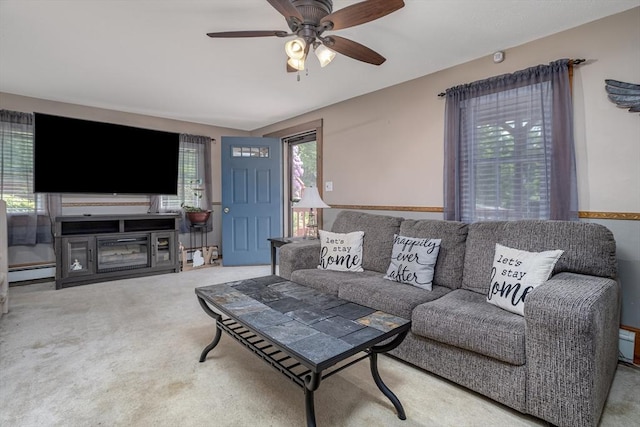 150 Appleton Cir, Fitchburg, MA 01420 - carpeted living room with a baseboard radiator and a ceiling fan