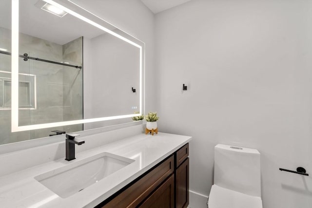 bathroom featuring visible vents, toilet, a stall shower, and vanity