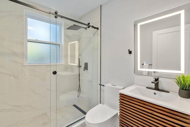 full bath with a marble finish shower, toilet, and vanity