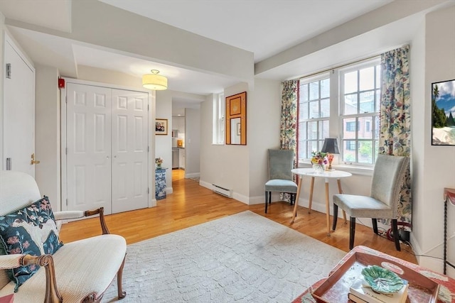 15 River Unit 306, Boston, MA 02108 - living area featuring a baseboard radiator, light wood-style flooring, and baseboards
