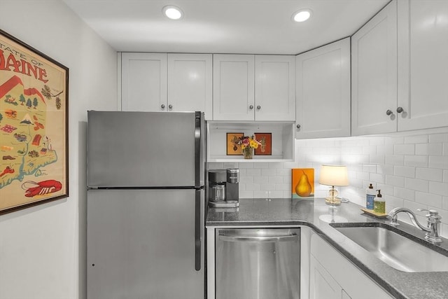 15 River Unit 306, Boston, MA 02108 - kitchen with stainless steel appliances, a sink, white cabinets, decorative backsplash, and recessed lighting