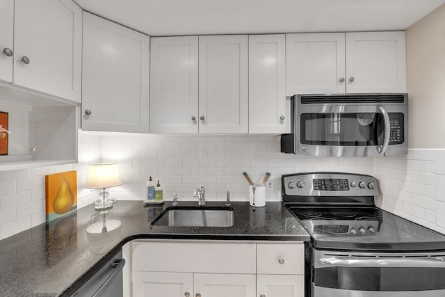 15 River Unit 306, Boston, MA 02108 - kitchen with appliances with stainless steel finishes, a sink, white cabinetry, and tasteful backsplash