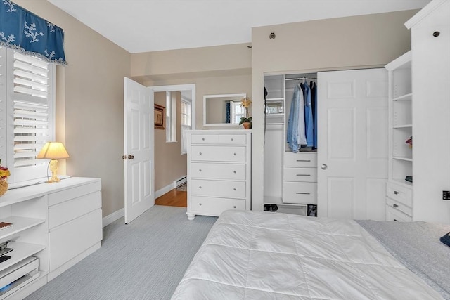 15 River Unit 306, Boston, MA 02108 - bedroom with light carpet, a closet, and baseboards