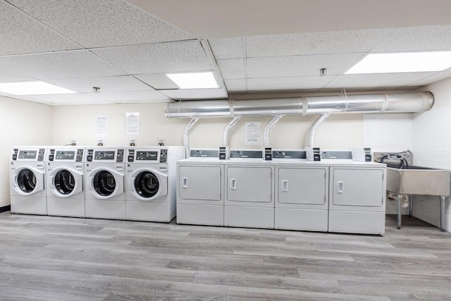 15 River Unit 306, Boston, MA 02108 - communal laundry room featuring washing machine and clothes dryer and wood finished floors