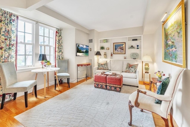 15 River Unit 306, Boston, MA 02108 - living area featuring wood finished floors, baseboards, and built in shelves