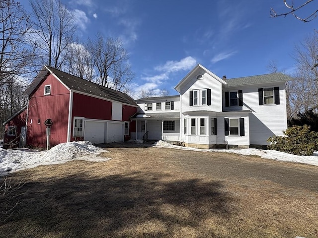 view of front of property with an outbuilding and a garage