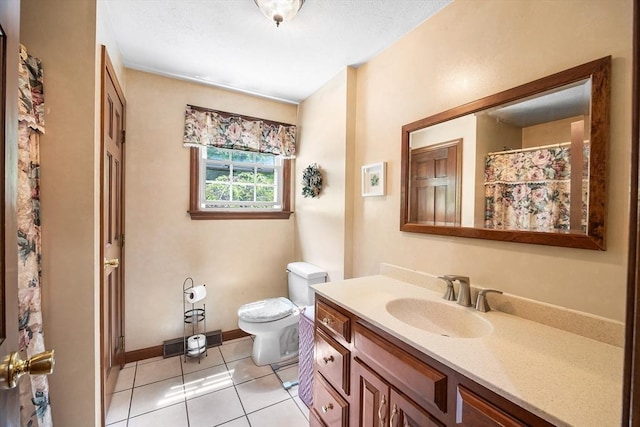 19 K St, Weymouth, MA 02189 - full bath featuring toilet, vanity, tile patterned floors, and baseboards