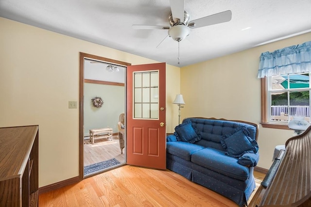19 K St, Weymouth, MA 02189 - living area with light wood finished floors, a ceiling fan, and baseboards