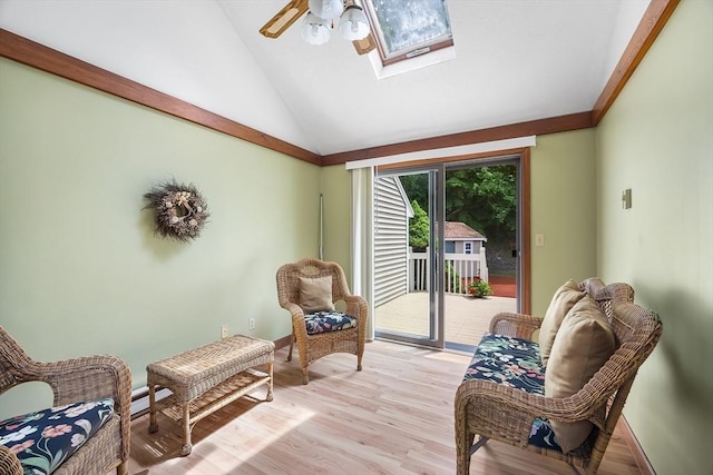 19 K St, Weymouth, MA 02189 - living area with a ceiling fan, a skylight, light wood-type flooring, baseboards, and high vaulted ceiling