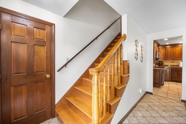19 K St, Weymouth, MA 02189 - stairway with baseboards, tile patterned floors, and recessed lighting