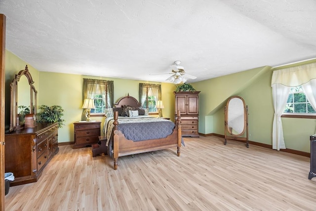 19 K St, Weymouth, MA 02189 - bedroom with light wood-type flooring, baseboards, and a ceiling fan