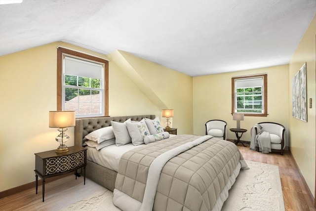 19 K St, Weymouth, MA 02189 - bedroom with multiple windows, vaulted ceiling, light wood-style flooring, and baseboards