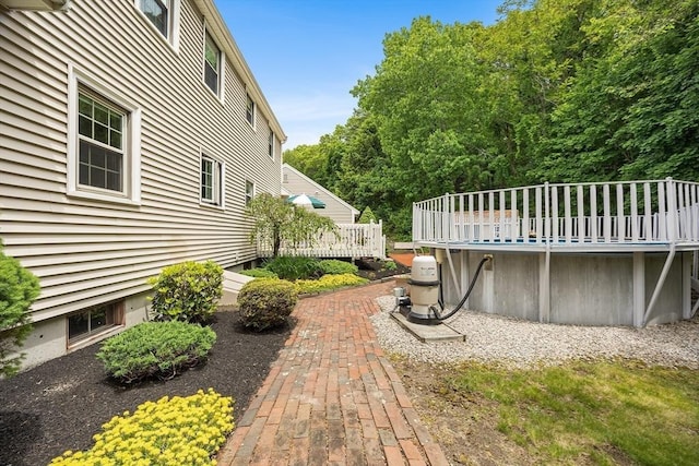 19 K St, Weymouth, MA 02189 - view of side of property featuring a wooden deck and an outdoor pool