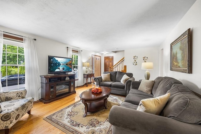 19 K St, Weymouth, MA 02189 - living area with stairs, light wood-type flooring, and plenty of natural light