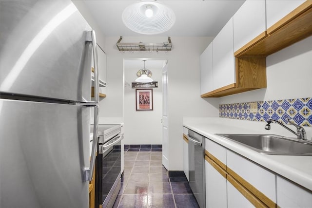 235 State St Unit 317, Springfield, MA 01103 - kitchen with appliances with stainless steel finishes, white cabinetry, light countertops, a sink, and tasteful backsplash