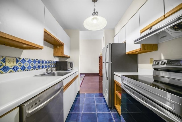 235 State St Unit 317, Springfield, MA 01103 - kitchen with appliances with stainless steel finishes, under cabinet range hood, a sink, and white cabinetry