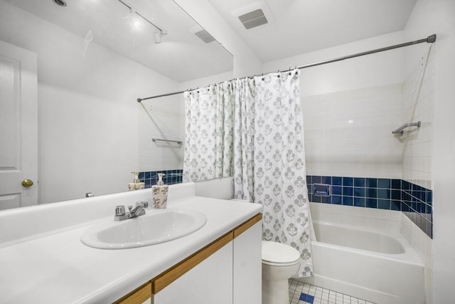 235 State St Unit 317, Springfield, MA 01103 - full bathroom with vanity, tile patterned floors, toilet, and shower / bath combo with shower curtain