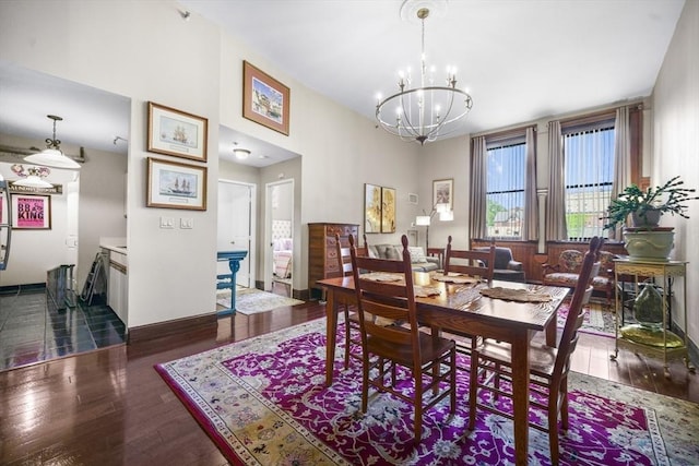 235 State St Unit 317, Springfield, MA 01103 - dining space with a chandelier, dark wood-type flooring, and baseboards