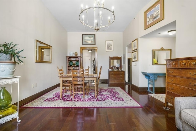 235 State St Unit 317, Springfield, MA 01103 - dining area featuring a chandelier, baseboards, and hardwood / wood-style flooring