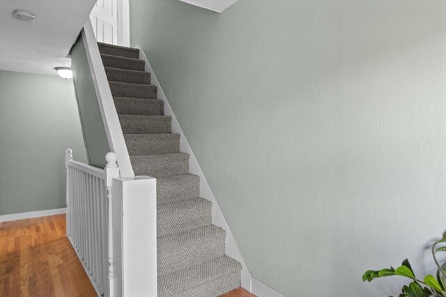 353 Medford St Unit 2, Malden, MA 02148 - stairs with wood finished floors and baseboards