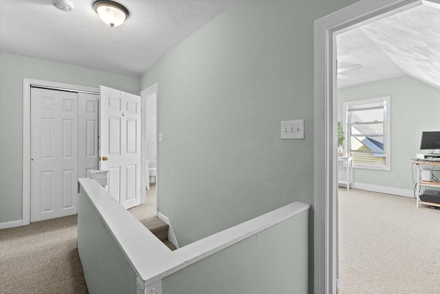 353 Medford St Unit 2, Malden, MA 02148 - hallway featuring carpet, baseboards, an upstairs landing, and lofted ceiling