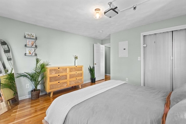 353 Medford St Unit 2, Malden, MA 02148 - bedroom with a closet, wood finished floors, baseboards, and electric panel