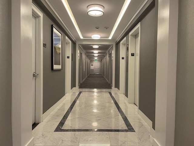 6 Whittier Pl Unit 15H, Boston, MA 02114 - hall with light marble finish floors, a raised ceiling, and inlaid floor details