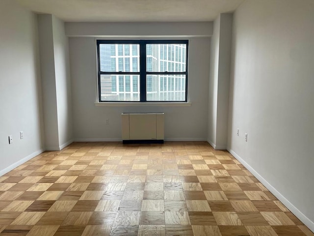 6 Whittier Pl Unit 15H, Boston, MA 02114 - unfurnished room featuring radiator heating unit and baseboards