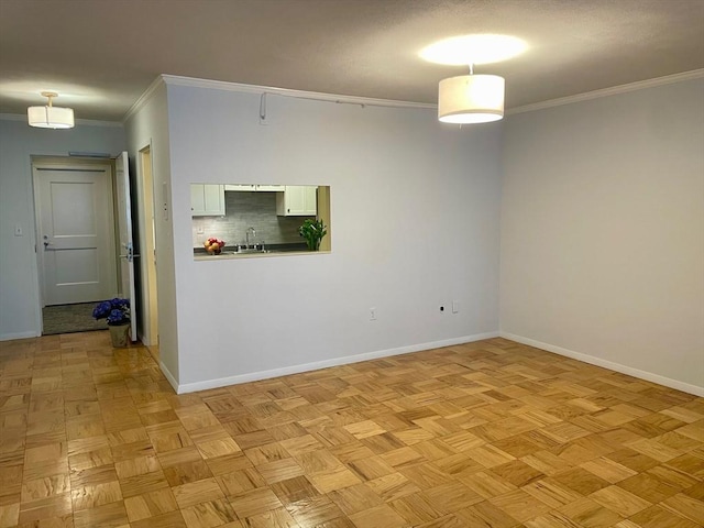 6 Whittier Pl Unit 15H, Boston, MA 02114 - unfurnished room featuring a sink and crown molding