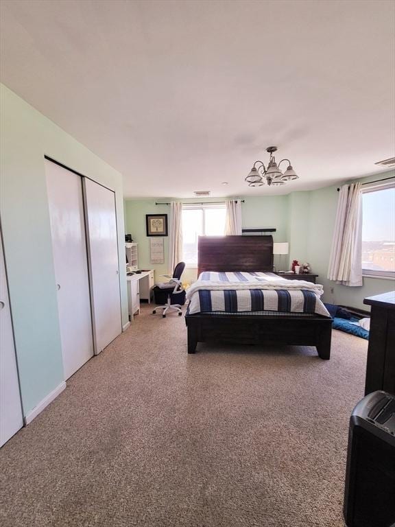 bedroom with carpet and multiple windows