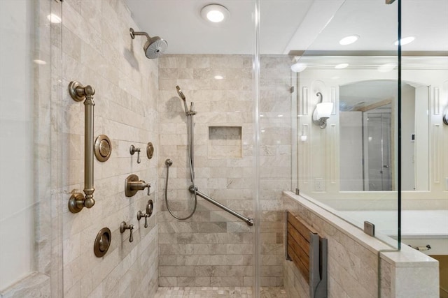 bathroom with a tile shower