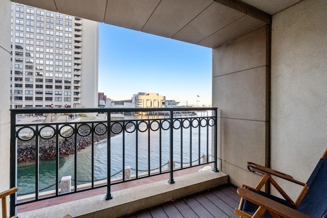 balcony featuring a water view