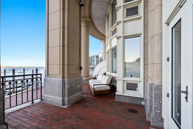 view of patio featuring a balcony