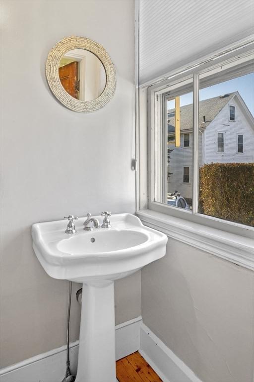 bathroom featuring sink and hardwood / wood-style flooring